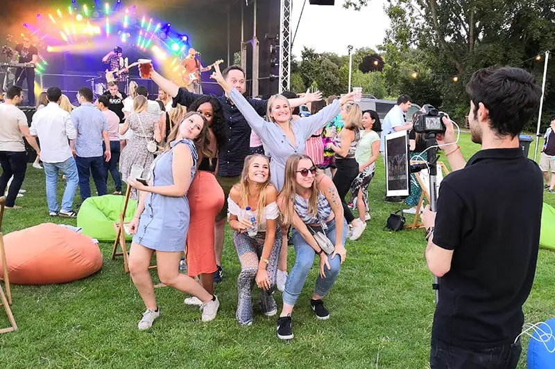 Guests enjoying a photo booth at a Miami celebration